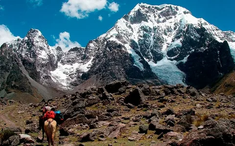 High altitude Andean puna landscape with snow-capped peaks on the Seven Lakes Tour route from Cusco