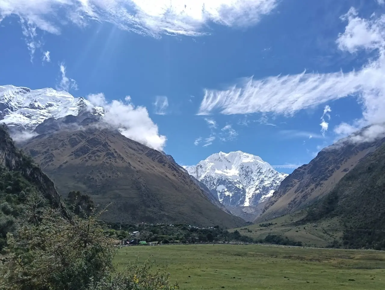 Salkantay trek 4 days panoramic view of the snow-capped Salkantay peak at sunrise from base camp