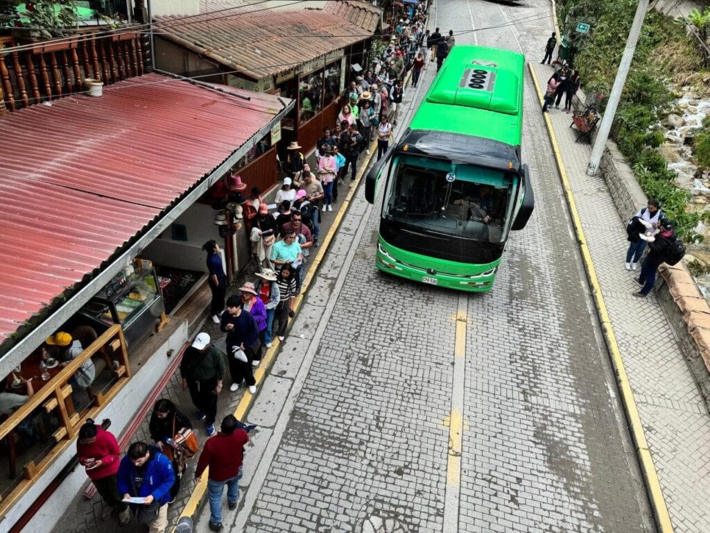 Bus queue at dawn with travelers waiting to go up to the citadel