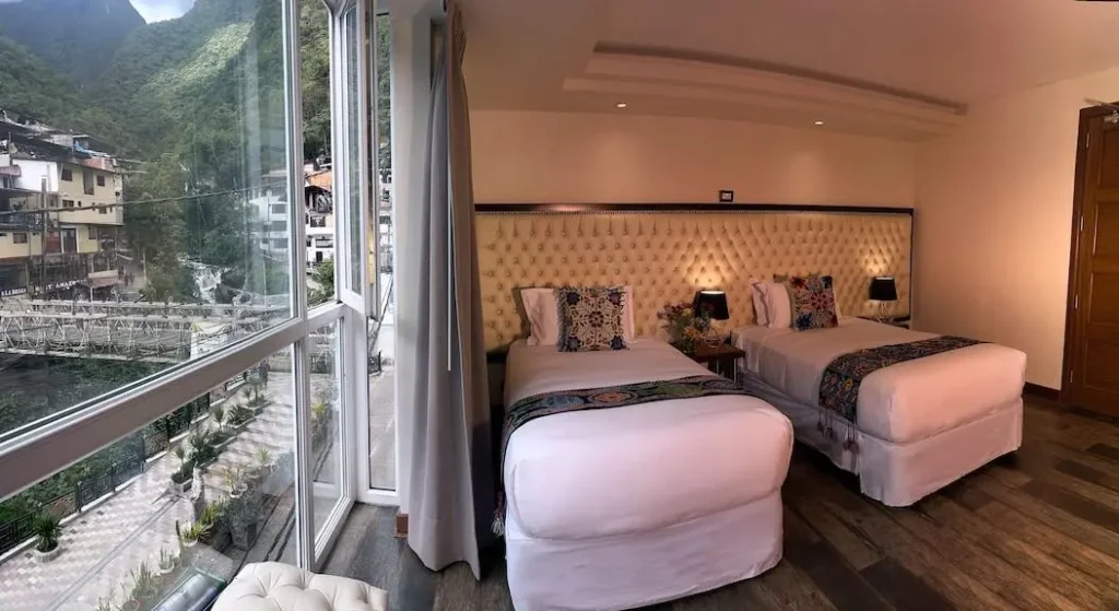 Luxury hotel room in Aguas Calientes with mountain views included in premium Machu Picchu package